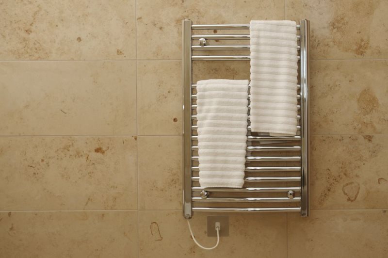 White towels on an electric heated towel rail