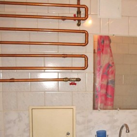 Copper pipe coil in the bathroom of a private house