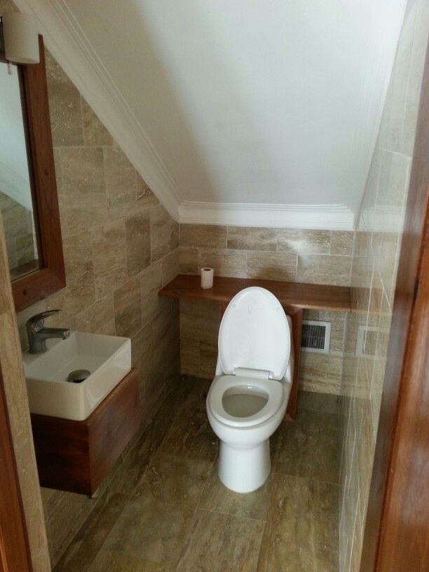 Flat level ceiling in the toilet under the stairs