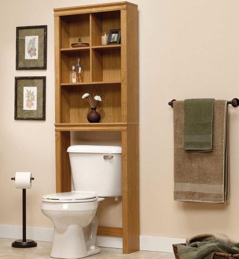 Wooden cabinet over the toilet flush tank