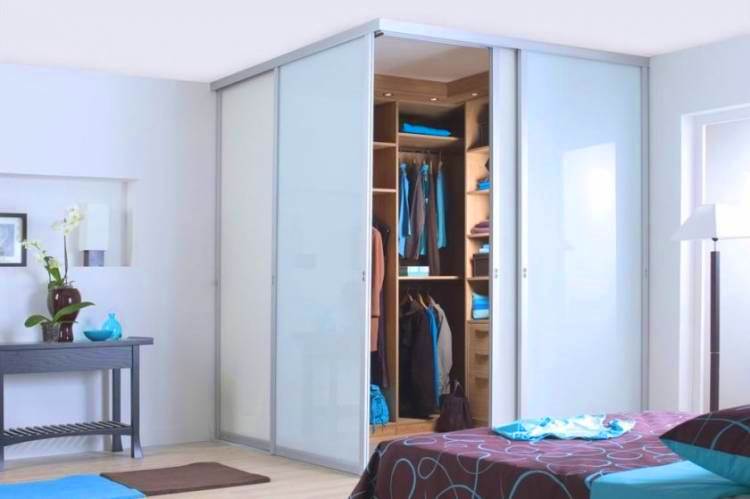 bedroom with corner wardrobe design