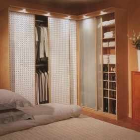 bedroom with corner wardrobe