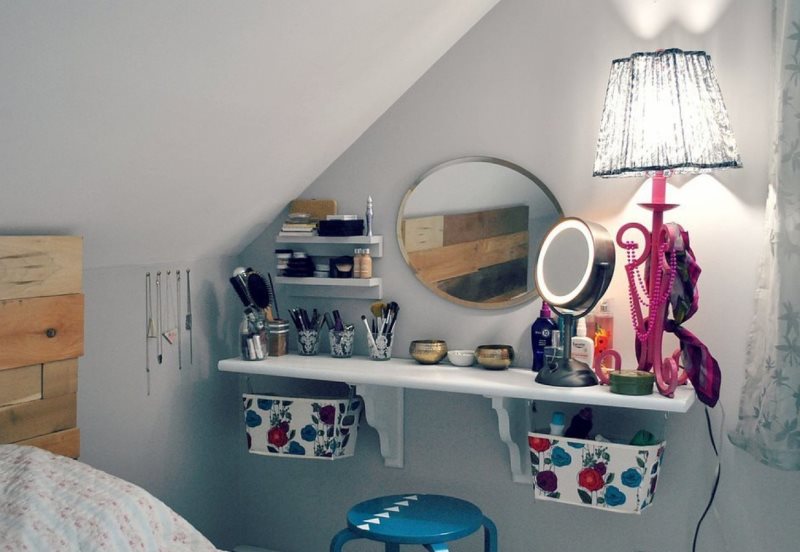 Wall-mounted dressing table in the attic bedroom