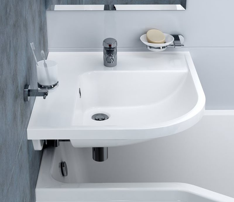 Corner sink over white bathtub