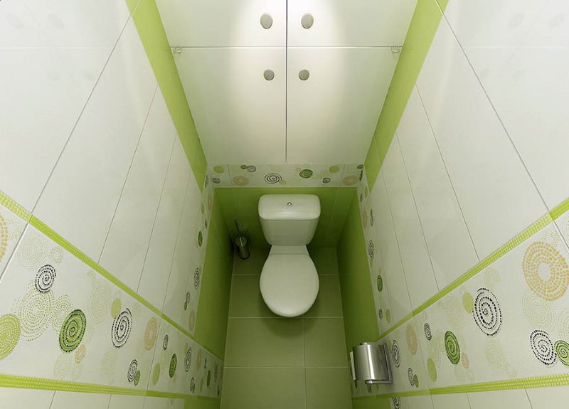 Groene toiletvloer met wit toilet