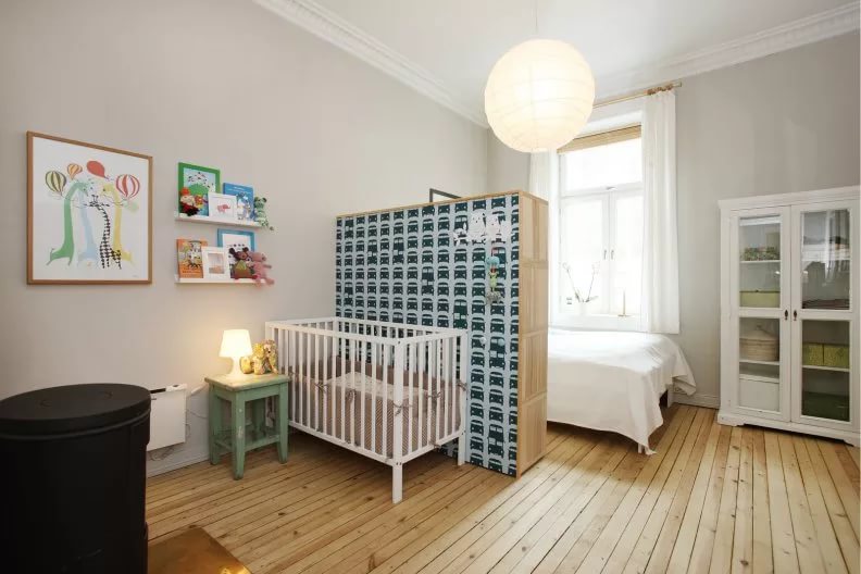 bedroom and children's room in one room design photo