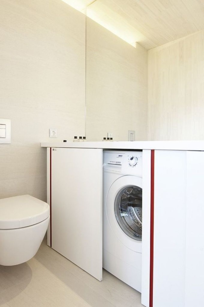 The washing machine in a curbstone with sliding doors