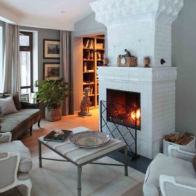 A cozy living room with a real hearth