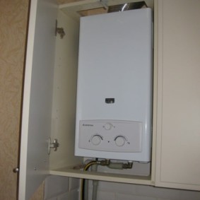 Installation of a gas column in a kitchen cabinet