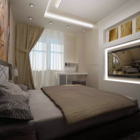 Two-level ceiling in the bedroom with a TV