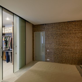 Glass partition between bedroom and dressing room