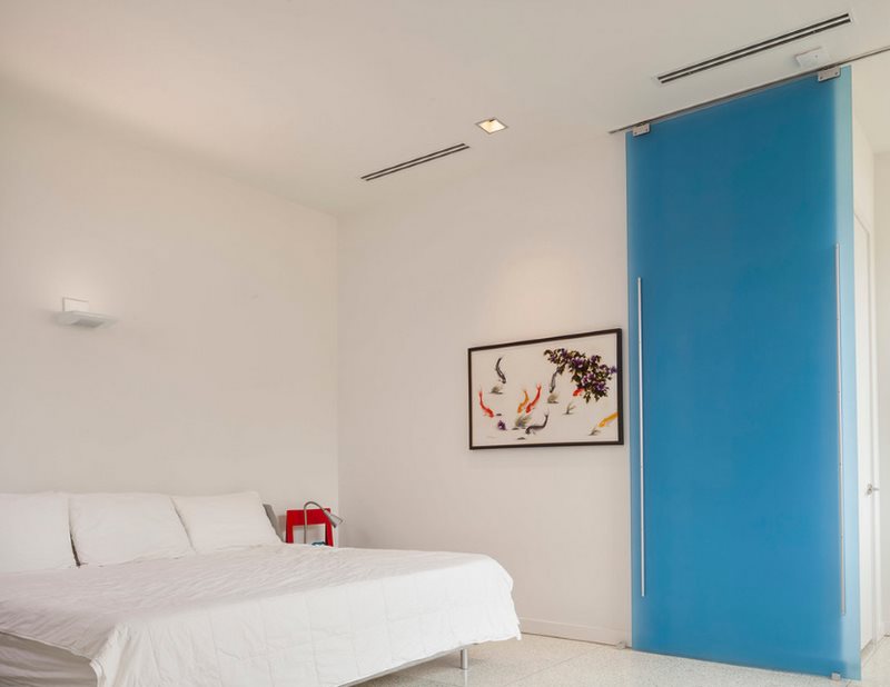 Blue sliding door in the bedroom interior