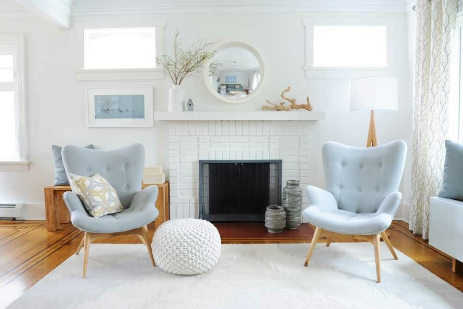 Bright Scandinavian style living room with fireplace
