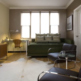 studio apartment na may disenyo ng kama at sofa