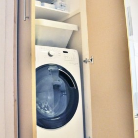 Tall and narrow cabinet for a washing machine