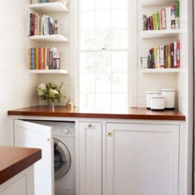 Book shelves near the bathroom window