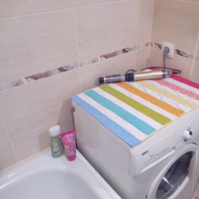 Striped mat on a washing machine