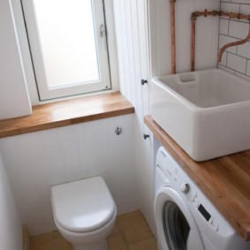 Overhead sink on wooden countertop