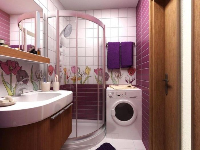 Washing machine in the interior of the bathroom with shower