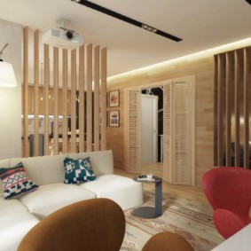 studio apartment na may mga ideya sa disenyo ng kama at sofa