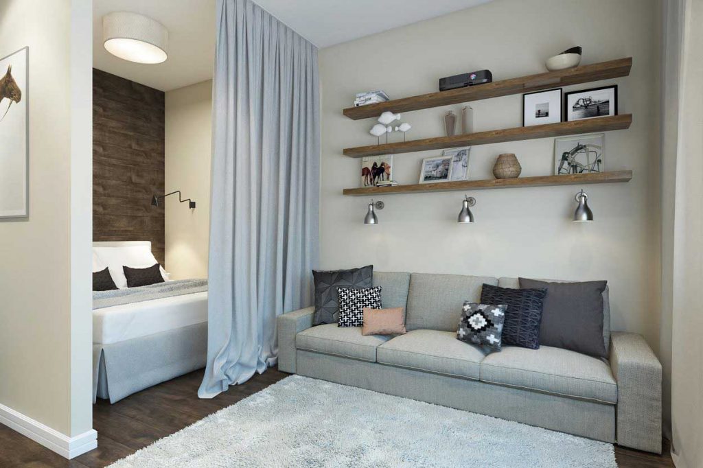 studio-appartement met uitzicht op een bed en een bank