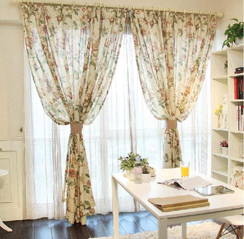 Curtains with a floral pattern on a round cornice
