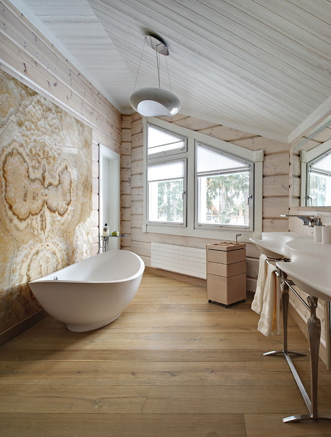 Beige bathroom in the attic of the log house