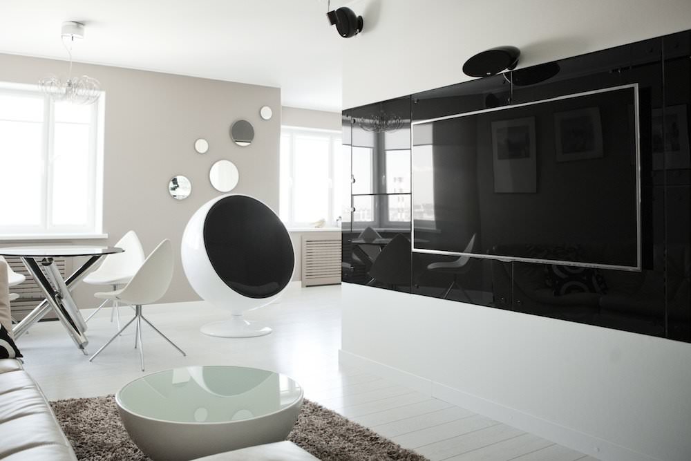 Black wall in a high-tech living room interior