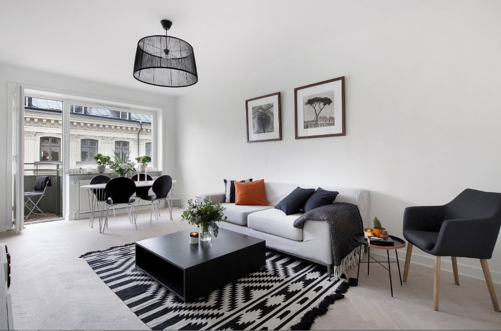 Black coffee table in a white living room