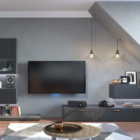 Black tv on gray wall