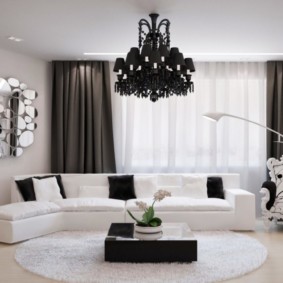 Black chandelier on a white ceiling
