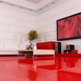 Red floor in the living room of the apartment