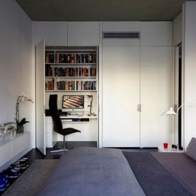 Wardrobe with a workplace in a bedroom