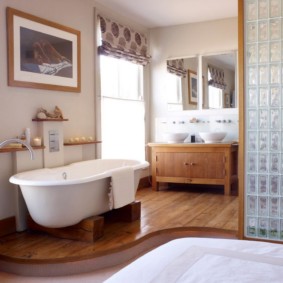 White bath on a wooden podium