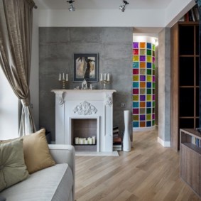 Fireplace in the interior of the living room apartment