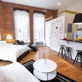 Wooden floor apartment with brick walls