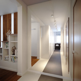 Gray flooring in a narrow hallway