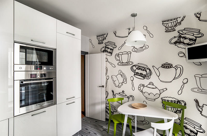 Desenhos a preto e branco de pratos na parede da cozinha