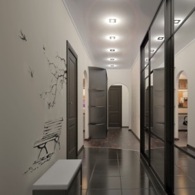 long narrow corridor in the apartment lighting