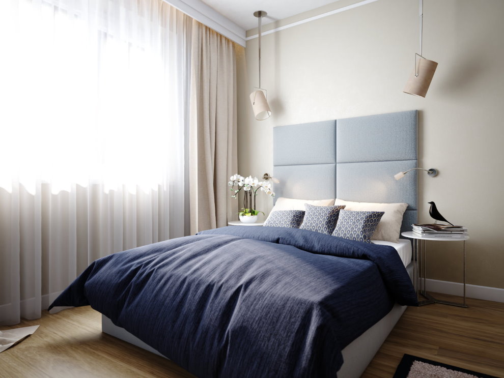 Bảng màu xám phía trên giường trong khu vực ngủ của căn hộ
