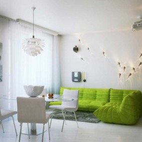 Green sofa in a large living room