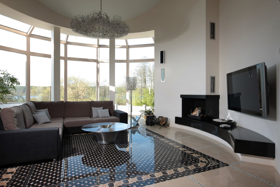 Panoramic glazing of the bay window of a high-tech living room