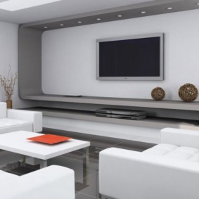 Hi-tech in the interior of a white living room