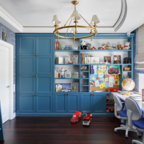 Blue furniture in a room with a high ceiling