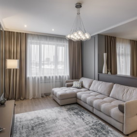 Kampinė sofa studijos tipo apartamentų gyvenamajame plote