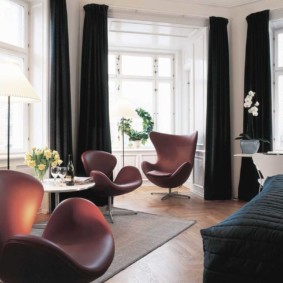 Black curtains in a bright room