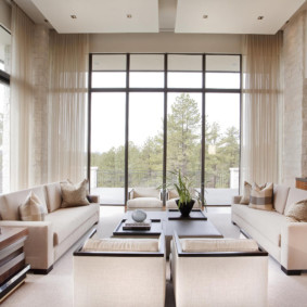 Panoramic windows in the living room with high ceiling