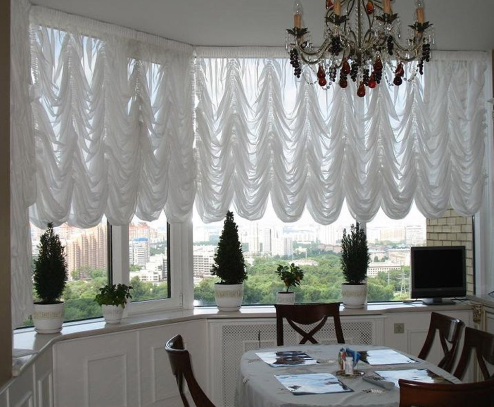 White French curtains on plastic bay window windows