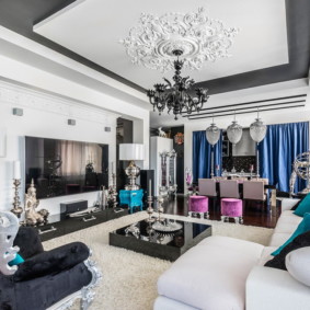Black ceiling chandelier with stucco molding