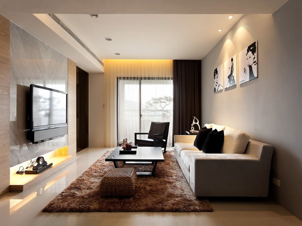 Narrow living room in a panel house apartment